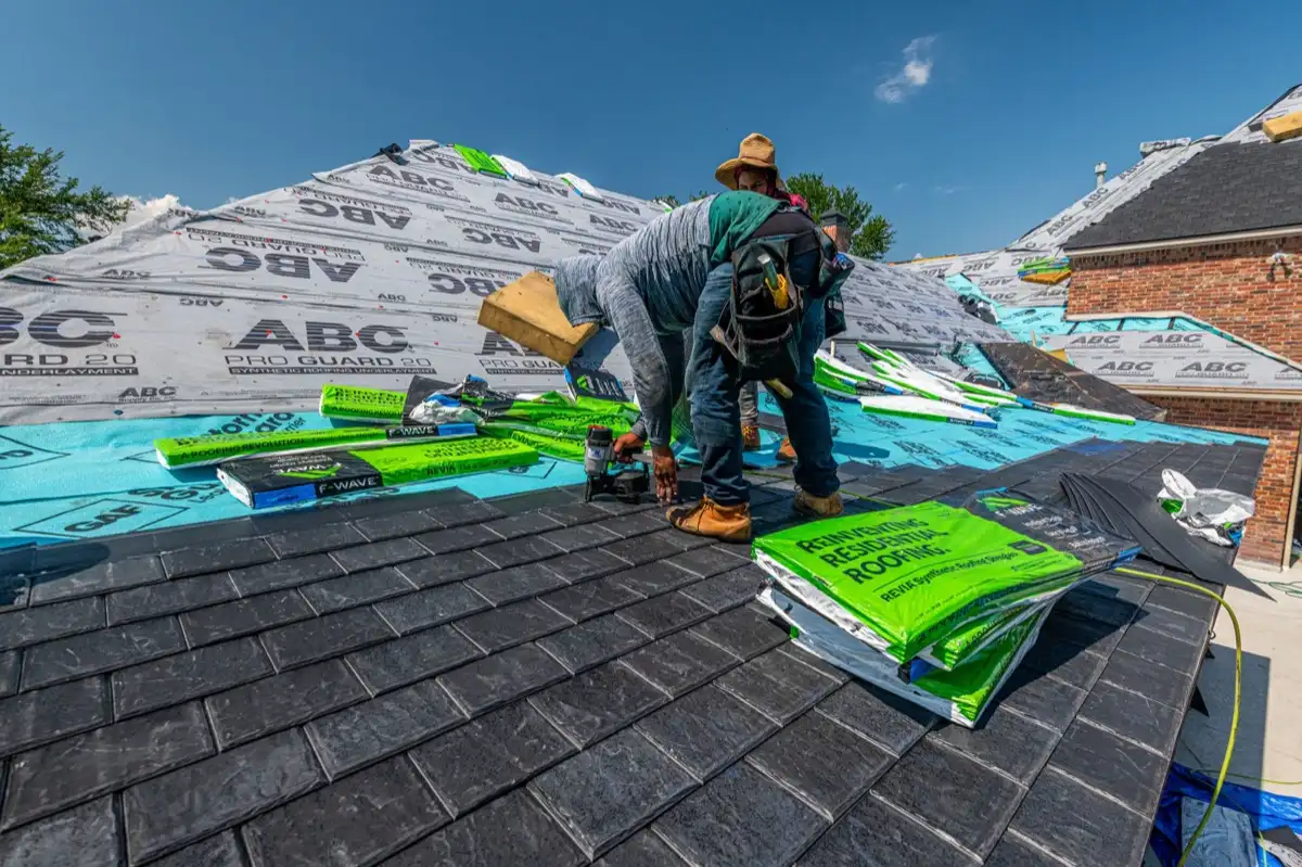 Roofer inspecting decking and underlayment on a residential roof in Melbourne, FL